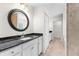 Elegant bathroom showcasing a granite countertop vanity, tiled shower, and ample storage space at 2575 Johannesberg Rd, North Port, FL 34288