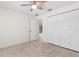 Bedroom featuring a ceiling fan, tile floor, and closet space at 2575 Johannesberg Rd, North Port, FL 34288