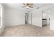 Serene bedroom with tile floors, a ceiling fan, and an adjacent doorway at 2575 Johannesberg Rd, North Port, FL 34288
