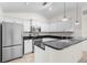 Kitchen with white cabinets, granite countertops, and stainless steel appliances at 2575 Johannesberg Rd, North Port, FL 34288
