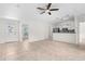 Cozy living room with tile flooring, and direct access to the kitchen and outdoor views at 2575 Johannesberg Rd, North Port, FL 34288