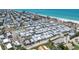 Drone image of a beach community with plenty of home, street parking and water access at 2601 Gulf N Dr # 733, Bradenton Beach, FL 34217