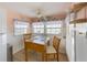 Bright dining area with a cozy table, enhanced by natural light and coastal-themed decorations at 2601 Gulf N Dr # 733, Bradenton Beach, FL 34217