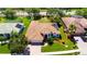 An aerial view of a single Gathering home with solar panels and a well manicured lawn at 2729 Harvest Dr, Sarasota, FL 34240