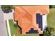 A high angle view of a house with solar panels on the roof and manicured lawn at 2729 Harvest Dr, Sarasota, FL 34240