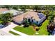 An aerial view of a single Gathering home with solar panels and a well manicured lawn at 2729 Harvest Dr, Sarasota, FL 34240