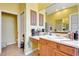 Bathroom vanity with plenty of counter space, warm lighting, and neutral tones at 2729 Harvest Dr, Sarasota, FL 34240
