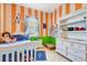 Bright bedroom with cheerful colors and playful decor at 2729 Harvest Dr, Sarasota, FL 34240