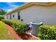 Exterior view with well-maintained landscaping and AC unit at 2729 Harvest Dr, Sarasota, FL 34240