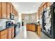 Spacious kitchen with modern appliances, dark countertops, and ample storage at 2729 Harvest Dr, Sarasota, FL 34240