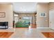Spacious living room boasting a green sofa, ceiling fan, and hardwood floors at 2729 Harvest Dr, Sarasota, FL 34240