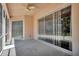 Enclosed patio with ceiling fan and clear vinyl weather protection at 2729 Harvest Dr, Sarasota, FL 34240