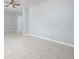 Bright living area with neutral-toned walls and tile flooring, creating a clean and versatile space at 2739 Palmadelia Ave, Sarasota, FL 34234