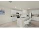 Modern kitchen featuring stainless steel appliances, island with seating, and sleek cabinets at 27519 Pasto Dr, Punta Gorda, FL 33983