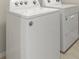 Featuring a white Whirlpool washer and dryer set in a well-lit laundry area at 27519 Pasto Dr, Punta Gorda, FL 33983