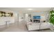Spacious living room featuring an open floor plan and tile flooring at 27519 Pasto Dr, Punta Gorda, FL 33983