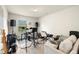 Living room furnished with musical equipment, sofa, and neutral color palette, creating a comfortable, usable space at 27519 Pasto Dr, Punta Gorda, FL 33983