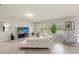Spacious living room with tile floors, bright windows, and modern decor at 27519 Pasto Dr, Punta Gorda, FL 33983
