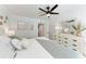 Comfortable bedroom features bright natural light and a large dresser at 301 Highland Ave # 3, Bradenton Beach, FL 34217