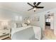 Comfortable bedroom features bright natural light and views to the living room at 301 Highland Ave # 3, Bradenton Beach, FL 34217