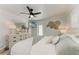 Comfortable bedroom features bright natural light and beach themed decor at 301 Highland Ave # 3, Bradenton Beach, FL 34217