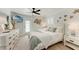 Comfortable bedroom features bright natural light and a ceiling fan at 301 Highland Ave # 3, Bradenton Beach, FL 34217