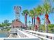 Picturesque view of the clock tower next to the water at 301 Highland Ave # 3, Bradenton Beach, FL 34217