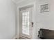 The interior entrance showcases a stylish door with louvered windows and a modern lock at 301 Highland Ave # 3, Bradenton Beach, FL 34217
