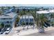 A beautiful two story home with a white fence and multiple parking spaces at 301 Highland Ave # 3, Bradenton Beach, FL 34217