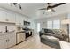 This open-concept living area is equipped with stainless steel appliances, and a comfortable sofa at 301 Highland Ave # 3, Bradenton Beach, FL 34217