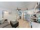 The living room with stainless steel appliances is connected to a dining area at 301 Highland Ave # 3, Bradenton Beach, FL 34217