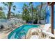 Relaxing private pool area surrounded by comfortable seating and lush greenery at 301 Highland Ave # 3, Bradenton Beach, FL 34217
