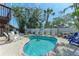 Inviting backyard pool area with plenty of seating perfect for relaxing at 301 Highland Ave # 3, Bradenton Beach, FL 34217