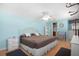 Bright bedroom with wood floors, ceiling fan, and comfortable bedding, creating a relaxing atmosphere at 307 White Oak Way, Sarasota, FL 34237