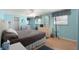 Comfortable main bedroom with a ceiling fan, wood-look flooring, and ample natural light at 307 White Oak Way, Sarasota, FL 34237