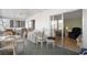 Relaxing sunroom featuring comfortable seating, and large windows for enjoying natural light and views at 307 White Oak Way, Sarasota, FL 34237