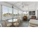 Sunroom with a ceiling fan, several windows, and casual seating at 307 White Oak Way, Sarasota, FL 34237