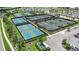 Aerial view of meticulously maintained tennis courts with professional surfaces at 3221 Vicenza Ct, Bradenton, FL 34211