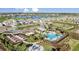 Aerial view of a community with a pool, fire pit, and beautiful landscaping at 3221 Vicenza Ct, Bradenton, FL 34211
