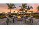 Outdoor fire pit with comfortable seating offers a cozy ambiance at 3221 Vicenza Ct, Bradenton, FL 34211