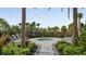 A hot tub surrounded by lush greenery offers a serene retreat at 3221 Vicenza Ct, Bradenton, FL 34211