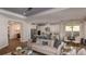 Open-concept living space featuring a modern kitchen, inviting living room, and stylish dining area at 3221 Vicenza Ct, Bradenton, FL 34211