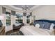 Serene main bedroom featuring large windows, elegant decor, and a view of the pool area at 3221 Vicenza Ct, Bradenton, FL 34211