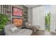 A relaxation room with comfortable chairs and a view of nature at 3221 Vicenza Ct, Bradenton, FL 34211
