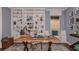 Stylish study featuring custom built-in shelves, a large desk, and comfortable seating at 3221 Vicenza Ct, Bradenton, FL 34211