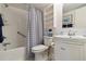 Well-maintained bathroom featuring a shower and tub, white tile, and a modern vanity at 3269 Beneva Rd # 103, Sarasota, FL 34232