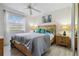 Serene bedroom featuring a ceiling fan, and natural light creating a peaceful retreat at 3269 Beneva Rd # 103, Sarasota, FL 34232