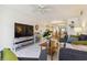 Comfortable living room with seamless flow into dining area and kitchen, featuring modern decor and abundant natural light at 3269 Beneva Rd # 103, Sarasota, FL 34232