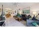 Open living room blending comfort and style, seamlessly flowing into the dining area, and kitchen space at 3269 Beneva Rd # 103, Sarasota, FL 34232