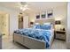 Comfortable bedroom featuring a ceiling fan, closet access, and light neutral paint at 3269 Beneva Rd # 103, Sarasota, FL 34232